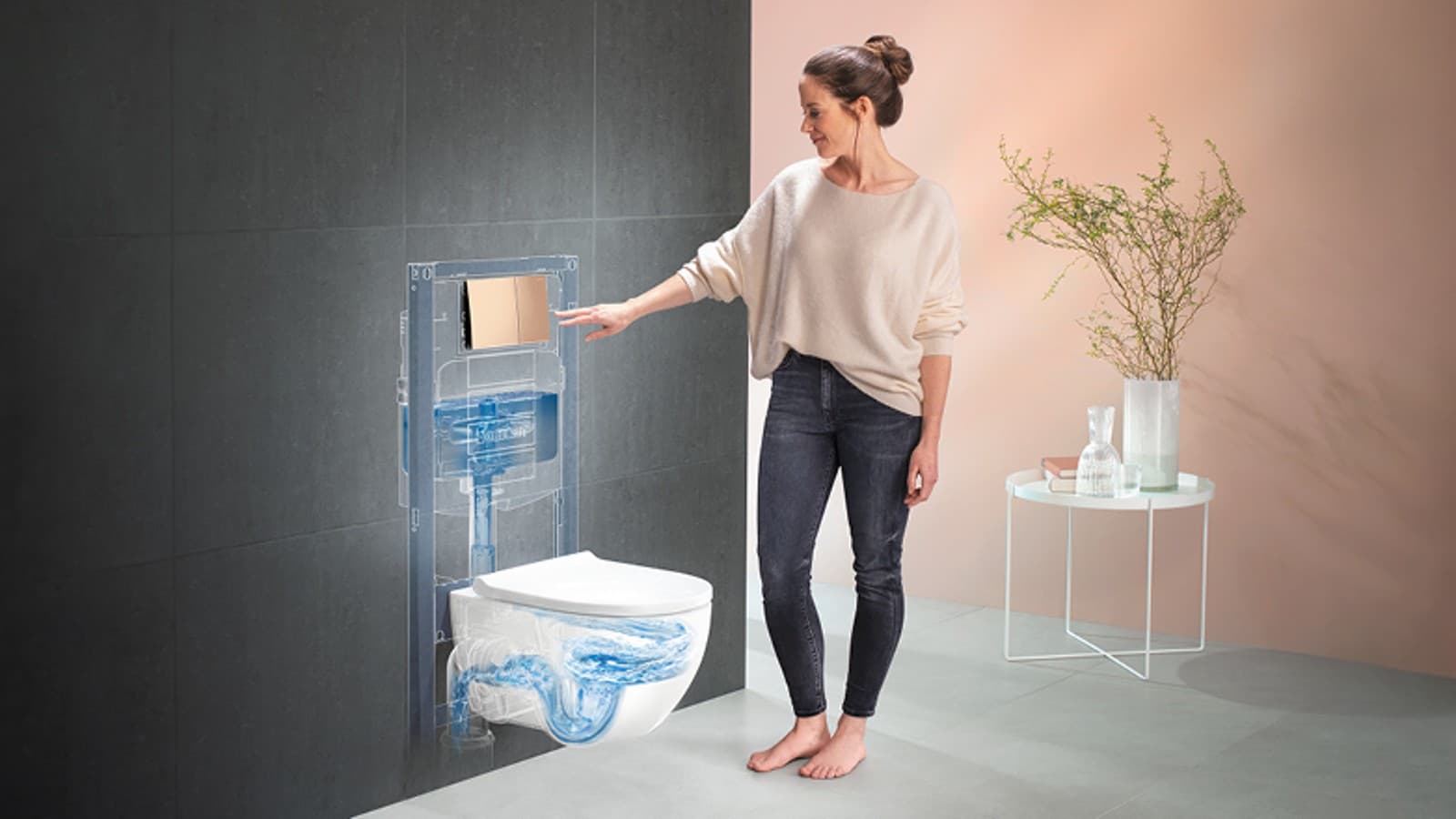 Woman presses actuator plate and flushes the Acanto WC Woman presses actuator plate and flushes the Acanto WC